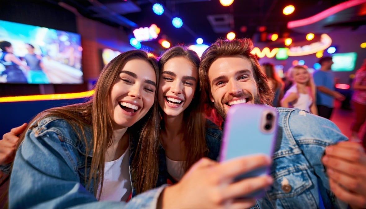 group of friends taking a selfie smiling having fun in an entertainment center