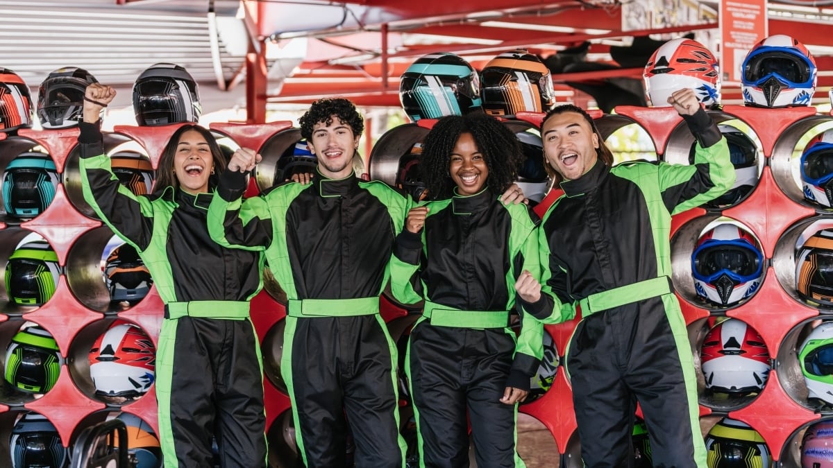 friends-celebrating-go-kart-racing-victory-indoors-2025-10-24-21-23-38-utc